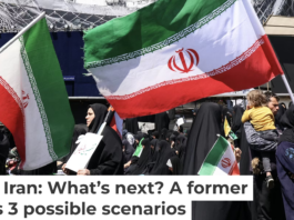 Iranians hold national flags in Tehran’s Revolution Square on April 8, 2026, after the United States and Iran agreed to a two-week ceasefire. Atta Kenare/AFP via Getty Images